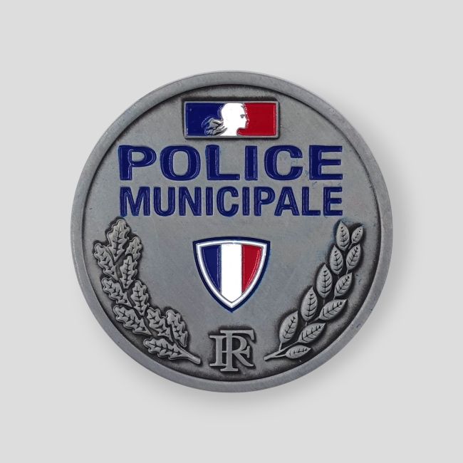 Metalowa odznaka w reliefie Policji Miejskiej - Patrol Equipement
